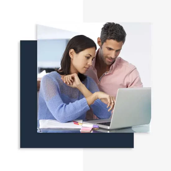 EnerWisely, young couple using laptop, The smart app to reduce your energy bills and your carbon footprint