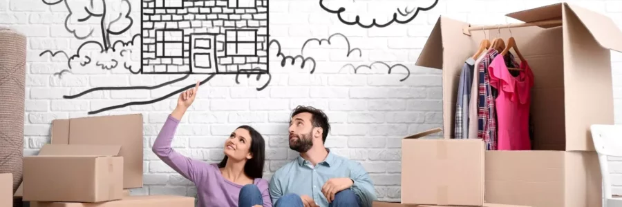 Young couple, moving, home drawing in background. Compare plans with EnerWisely smart app, see if Ambit Energy is right for you.