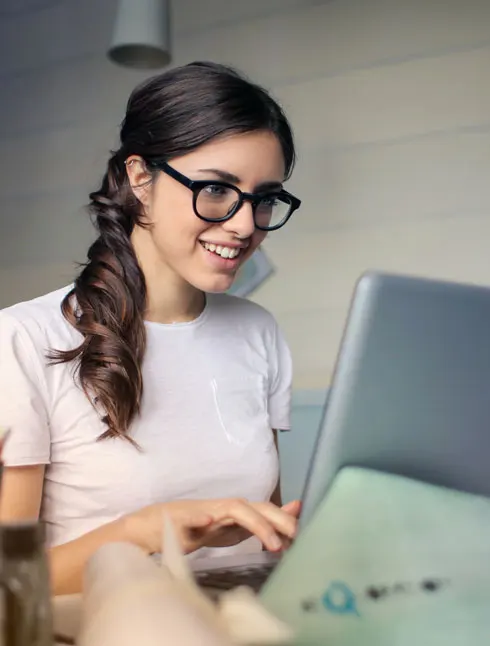 Picture, woman with laptop, EnerWisely is the smart sustainable energy savings app. Take the free online energy audit. Get cheap electricity. Save energy, save money, help the planet. 